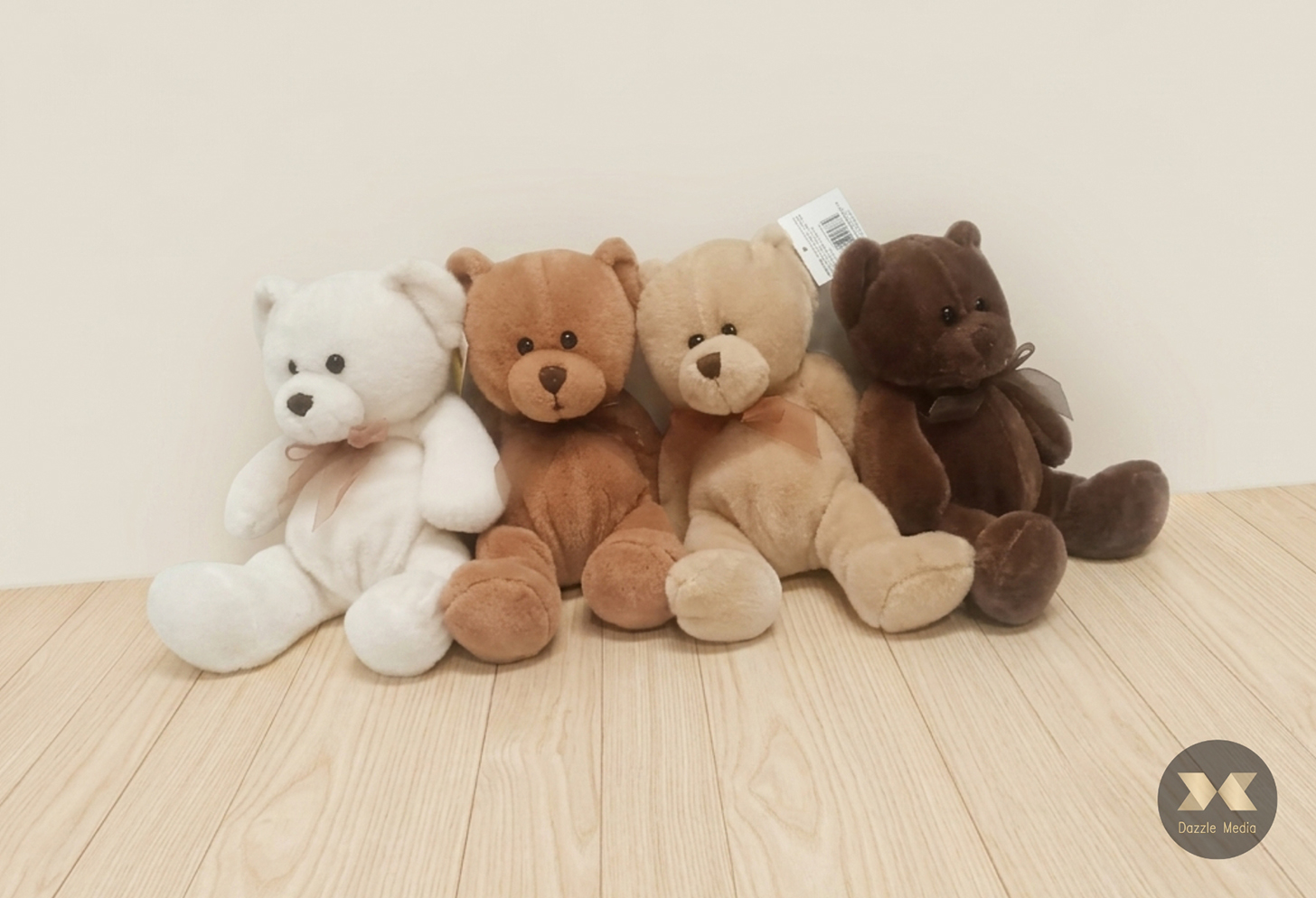 Set of four plush teddy bears in white and brown shades with ribbon bows for baby shower and kids party decor in Melbourne